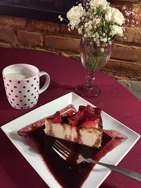 White Chocolate Cheesecake with strawberry/blueberry sauce at Austin Street Bistro