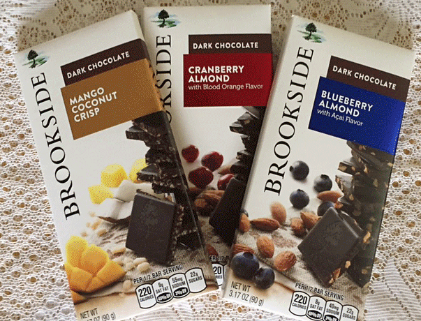 3 of Brookside's flavor pairings with dark chocolate - cranberry, blueberry and mango with coconut