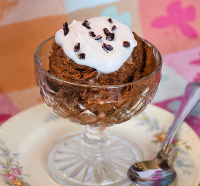 A vintage sherbet glass filled with chocolate mousse