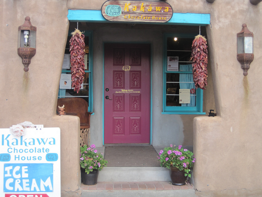The facade of Kakawa Chocolate house.  Love the pink front door.